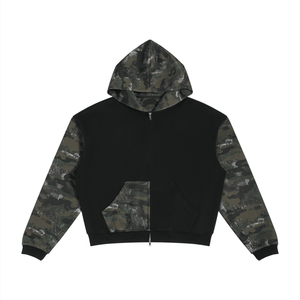 A black zip-up hoodie with camouflage pattern sleeves and a matching camouflage hood lining, displayed flat against a solid white background.