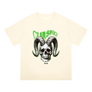 An off-white short-sleeve t-shirt featuring a graphic of a skull with large curved horns and the word 'CHURCH' in green above it, displayed on a solid white background.