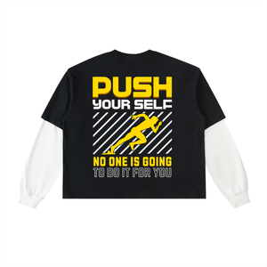 A black long-sleeve crop top with white sleeves, featuring a bold graphic on the back with yellow and white text and a running figure.