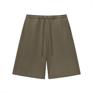 Green shorts with a drawstring on a white background