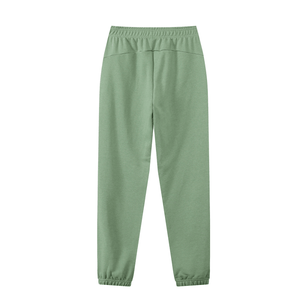 Green sweatpants on a white background