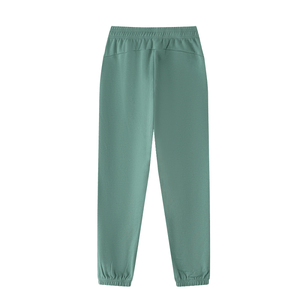 Green sweatpants on a white background