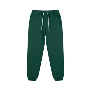 Green sweatpants with a white drawstring on a white background