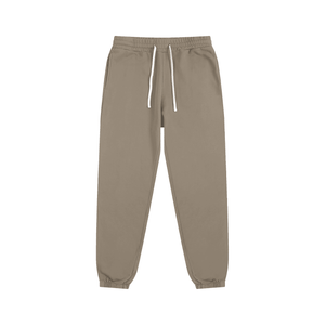 Beige sweatpants with a drawstring on a white background
