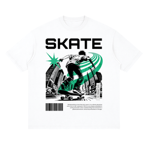 A white short-sleeve crewneck t-shirt featuring a bold graphic print on the front. The design displays the word 'SKATE' in large black capital letters above an illustration of a skateboarder in black and white, accented with a vibrant green starburst and green curved lines.