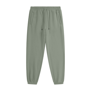 Green jogger pants on a white background