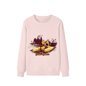 Pink sweatshirt with a graphic of two people in kayaks and 'Just Relax' text on a white background