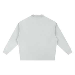 Light gray long-sleeve top on a white background