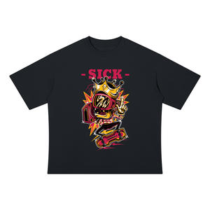 A black short-sleeve t-shirt with a colorful graphic on the chest. The graphic features a cartoon character wearing a gold crown and sunglasses, making a peace sign, with the word '-SICK-' printed in pink above it.