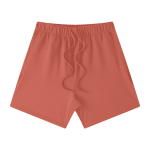 Red shorts with a small logo on a white background