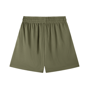 Green athletic shorts on a white background
