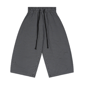 Black and white checkered pants on a white background