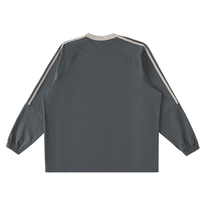 Back view of a dark gray jacket with white stripes on sleeves against a white background