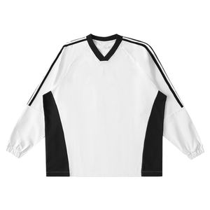 White long-sleeve shirt with black accents on a white background