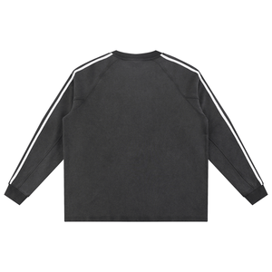 Black sweatshirt with white stripes on sleeves and back against a white background