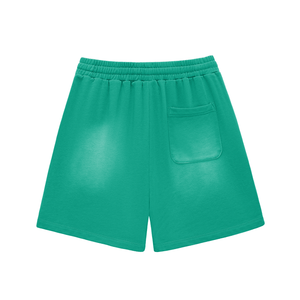 Green shorts with a pocket on a white background