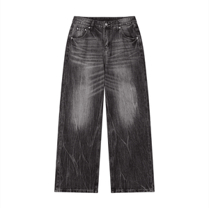 Black distressed jeans on a white background