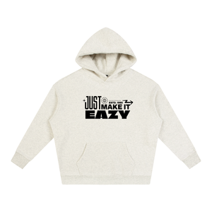 A light heather gray pullover hoodie with a black graphic text print reading 'JUST MAKE IT EASY' on the chest, displayed against a solid white background.