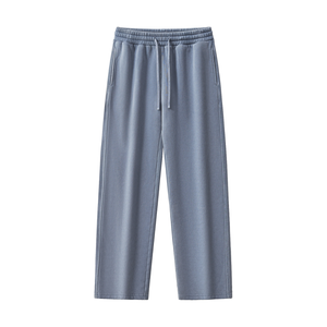 A pair of wide-leg sweatpants in a dusty slate blue color, featuring an elastic waistband with a matching drawstring and side pockets, shown against a plain white background.