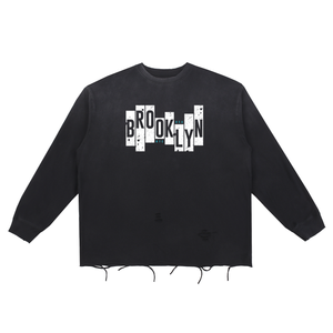 Black sweatshirt with white graphic and text on a white background
