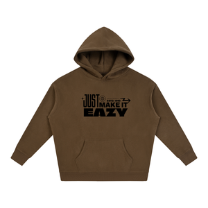 A brown pullover hoodie with a black graphic text print on the chest reading 'JUST MAKE IT EASY' and 'ESTD. 1969', displayed on a clean white background.