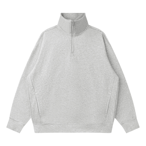 A light gray heathered quarter-zip sweatshirt with a mock neck collar, long sleeves, and side seam details, shown flat on a white background.