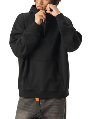 Person wearing a black hoodie on a white background