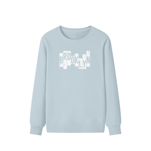 Light blue long-sleeve shirt with 'Brooklyn' text design on a white background