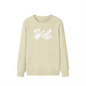 Beige long-sleeve shirt with 'Brooklyn' text design on a white background