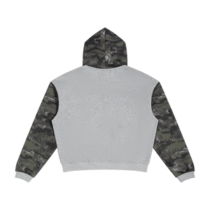 A cropped hoodie shown from the back, featuring a solid light gray fleece body, camouflage patterned sleeves, and a matching camouflage hood.