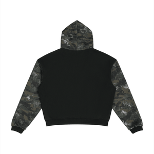 A black cropped hoodie with camouflage pattern sleeves and hood, shown from the back on a solid white background.