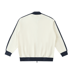 White jacket with navy accents on a white background