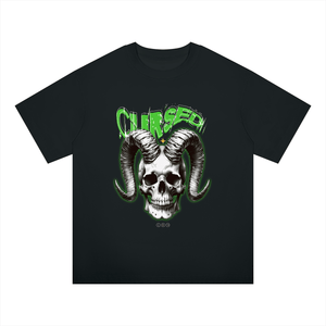 A black short-sleeve t-shirt featuring a graphic of a skull with large curved horns and the word 'Cursed' in green above it, shown on a plain white background.