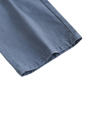 Close-up of a blue fabric edge on a white background