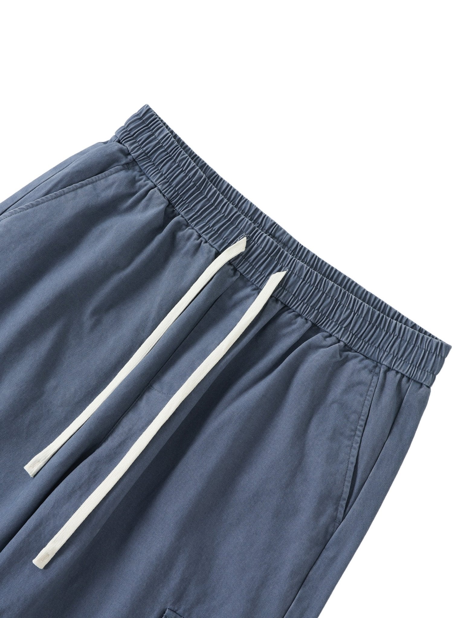 Blue shorts with white drawstring on a white background