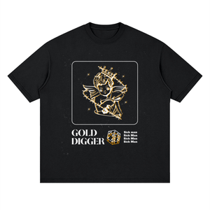 A black short-sleeve crewneck t-shirt with a graphic print on the front. The print features a gold line-art illustration of a winged figure holding a staff, surrounded by stars inside a square border.
