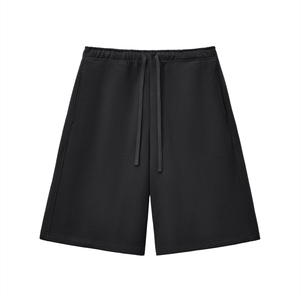 Black shorts with a drawstring on a white background