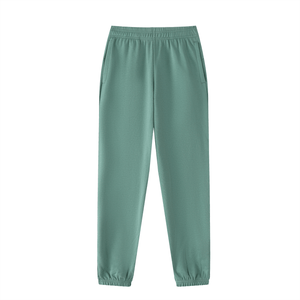 Green sweatpants on a white background