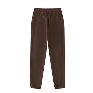 A pair of dark brown jogger-style pants with an elastic waistband and elastic cuffs, shown flat against a solid white background.