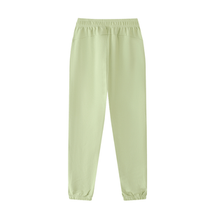 Light green sweatpants on a white background