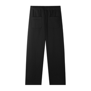 Black pants with two front pockets on a white background