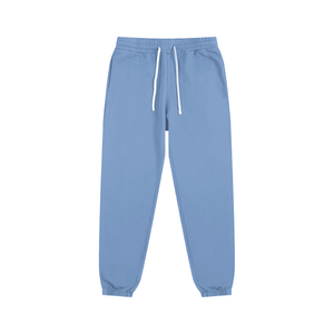 Light blue sweatpants with a drawstring on a white background