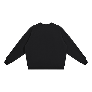 A plain black long-sleeve crewneck sweatshirt shown from the back, laid flat against a solid white background.