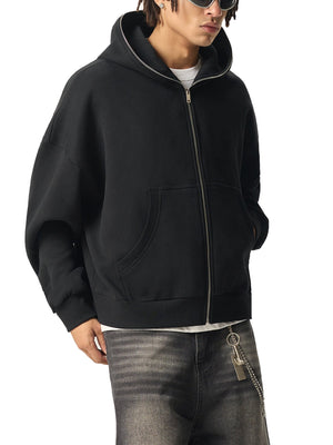Person wearing a black hoodie with a white background