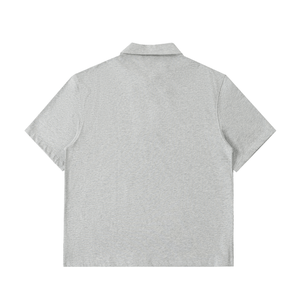 Gray polo shirt on a white background
