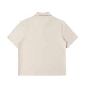 Beige polo shirt on a white background