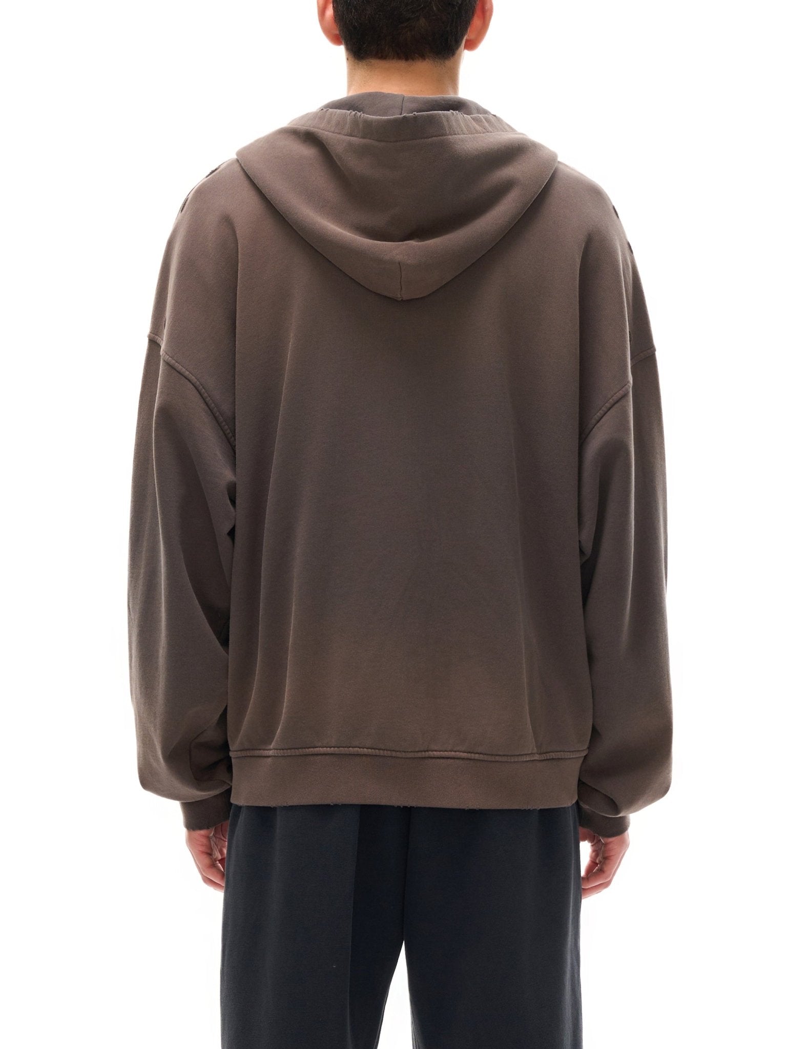 Person wearing a brown hoodie from behind on a white background
