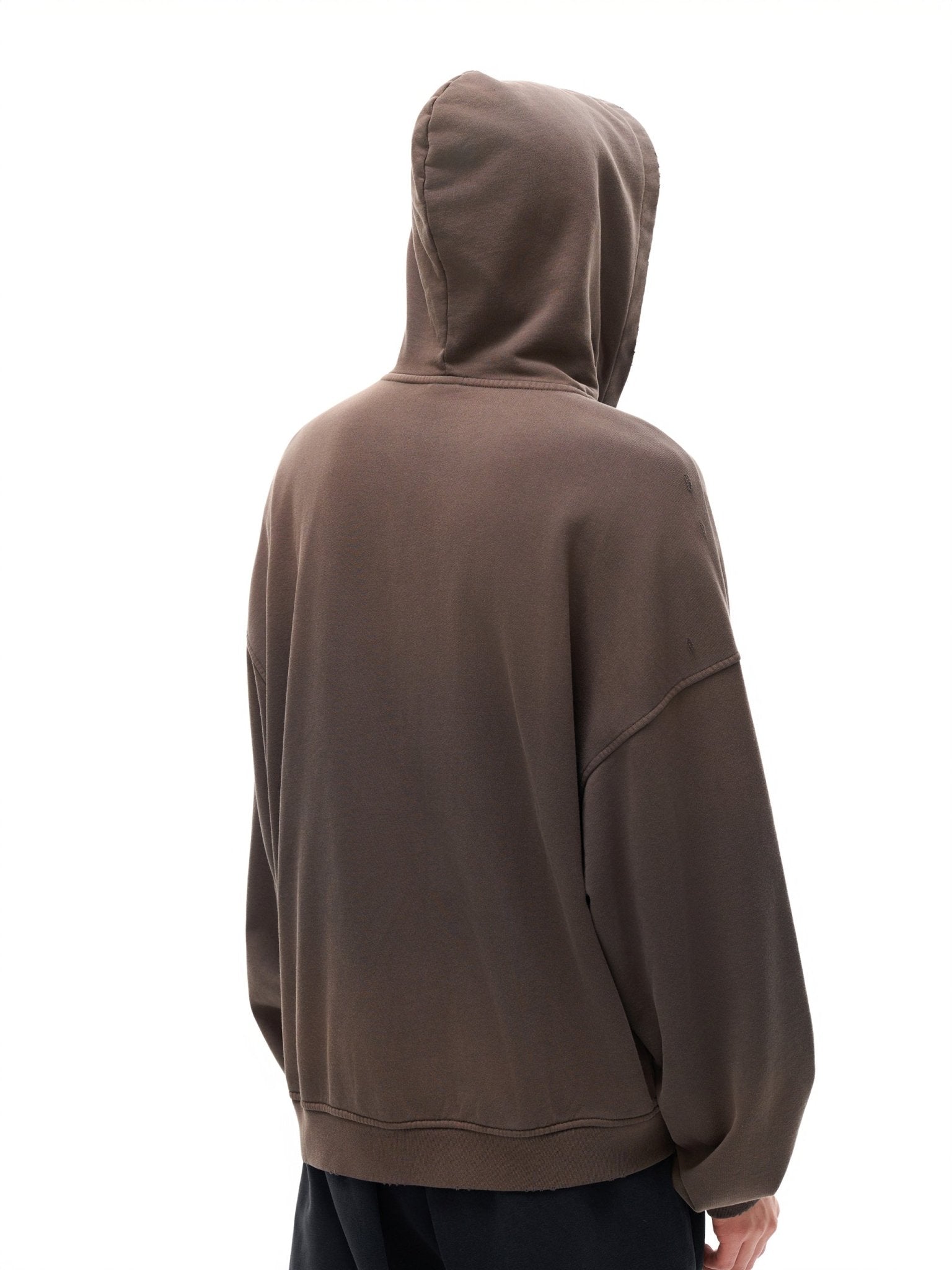 Brown hoodie worn by a person on a white background