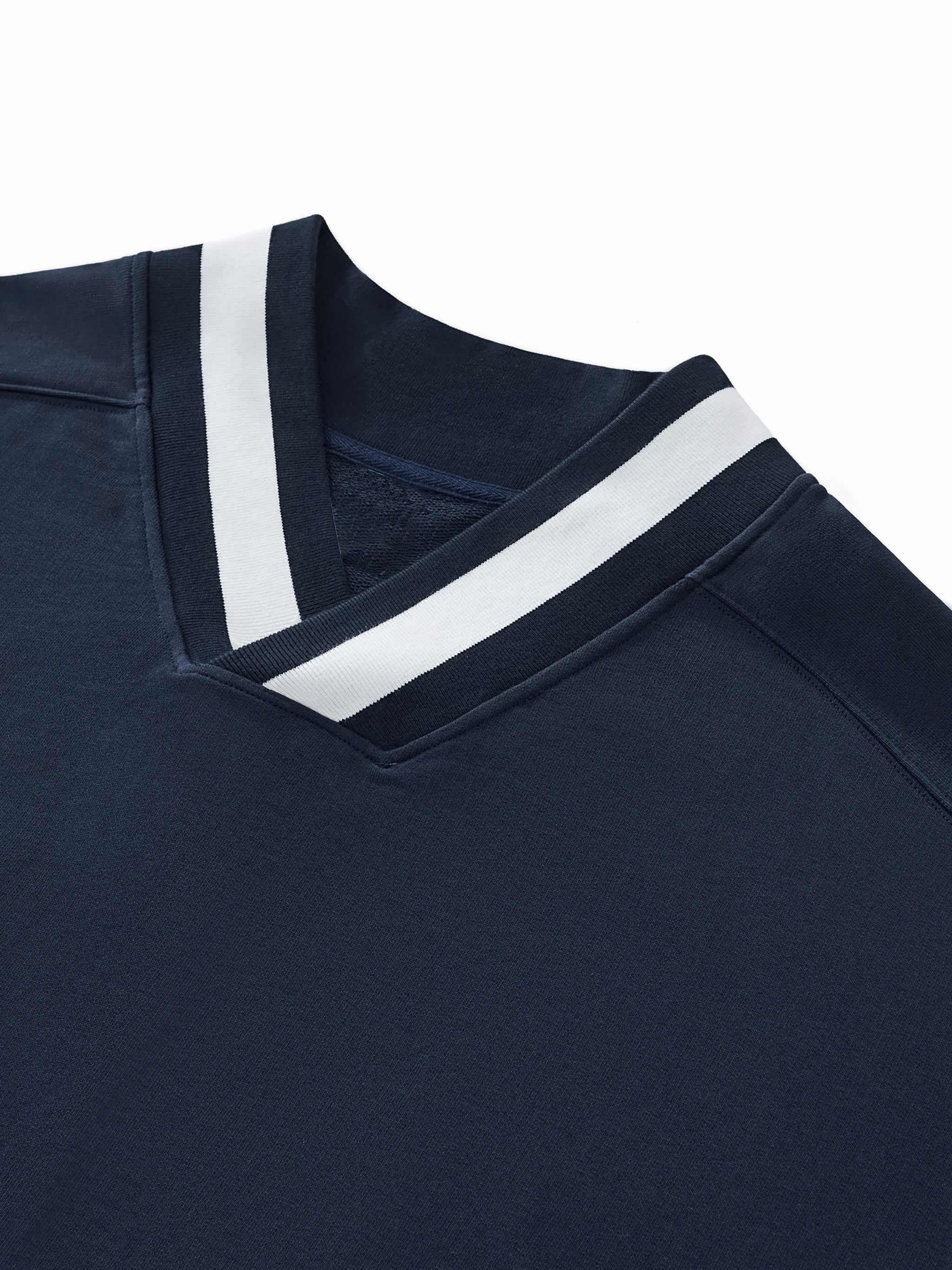 Navy blue polo shirt with white trim on a white background