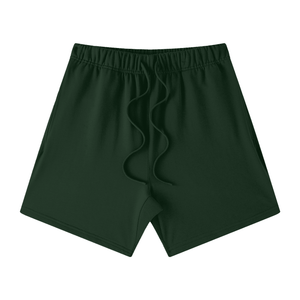 Dark green shorts with a brand logo on a white background